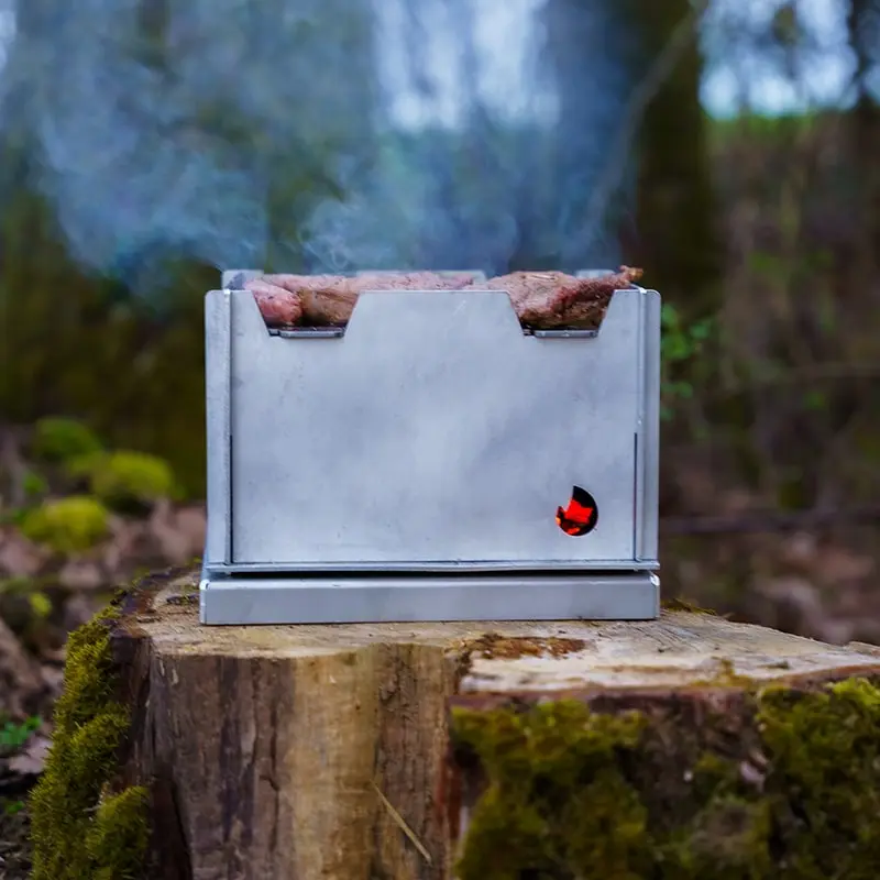 Grill assembled standing on a tree